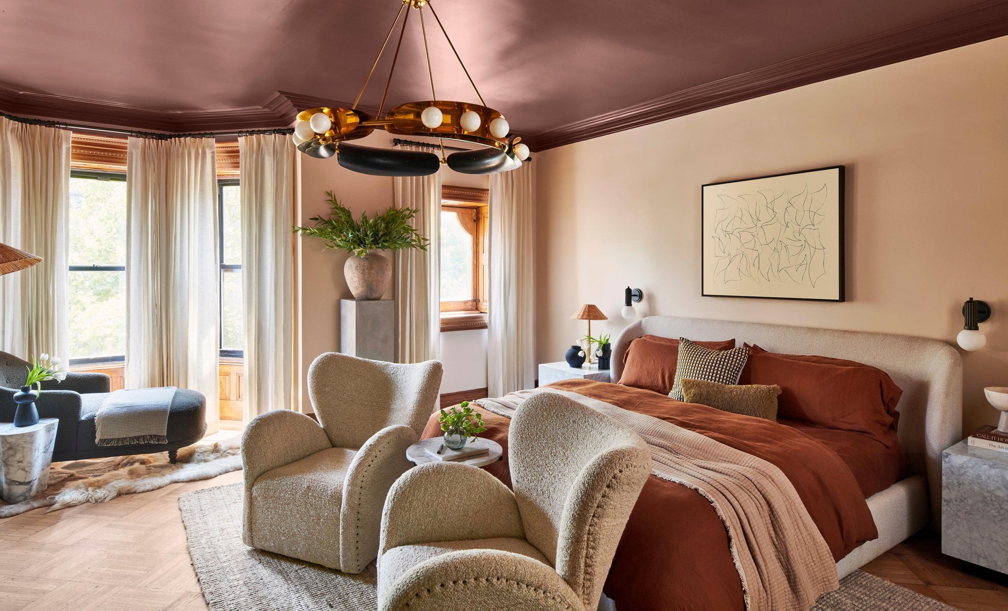 Reade Wall Sconce in Aged Brass styled in a warmly lit hallway for warm, layered light at Laurie Yapp Home.