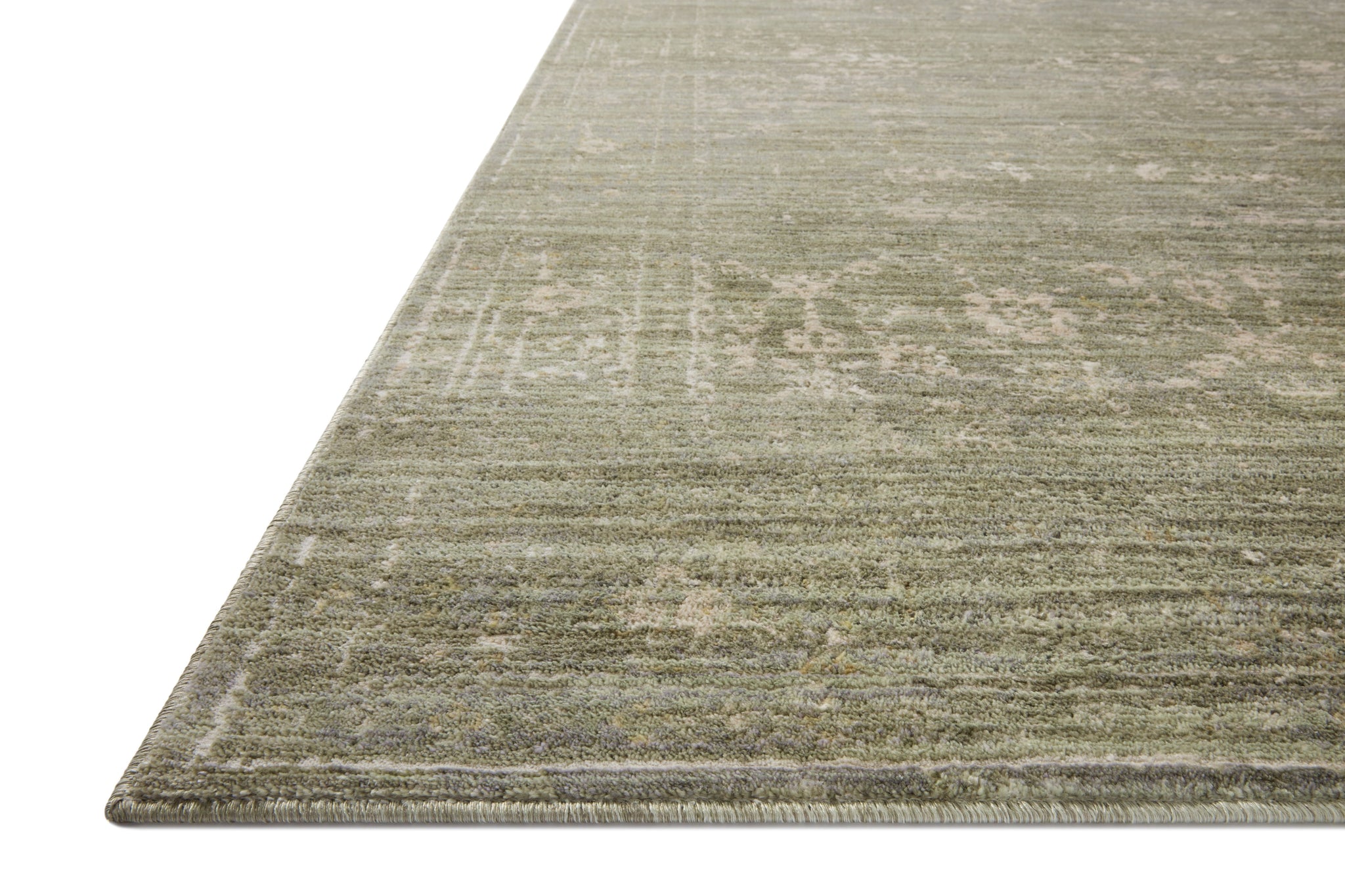 Side view of the Indra Sage / Natural rug.