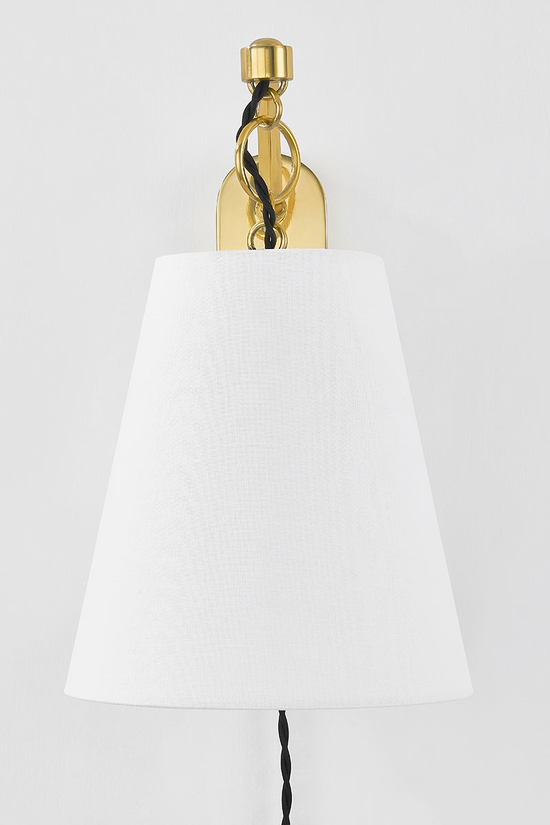 Joan Plug-In Sconce in aged brass — a Hudson Valley plug-in sconce for bedrooms, living rooms, and reading nooks at Laurie Yapp Home.
