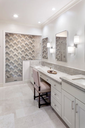 Junius Wall Sconce in polished nickel styled in a curated living room for warm, layered light at Laurie Yapp Home.