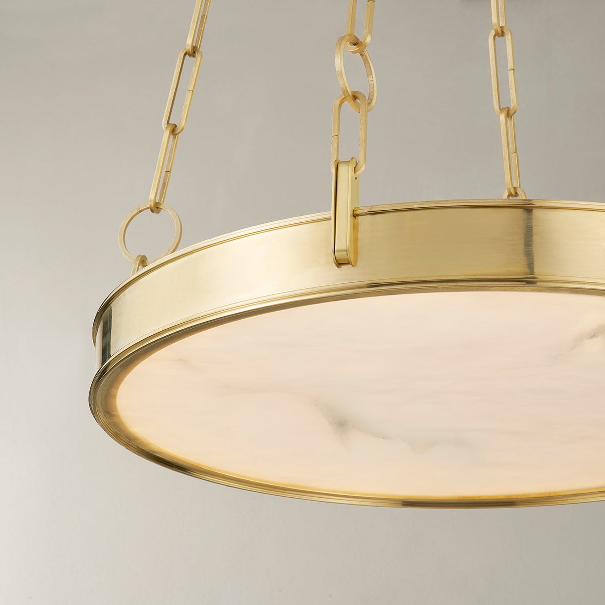 Kirby Chandelier 20" x 3.5" in aged brass shown from the front to reveal the frame, arms, and shade detail.