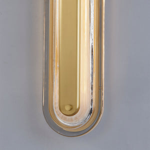 Litton Wall Sconce 5.75" x 28" in aged brass shown from the front to reveal the arm curve and shade silhouette.