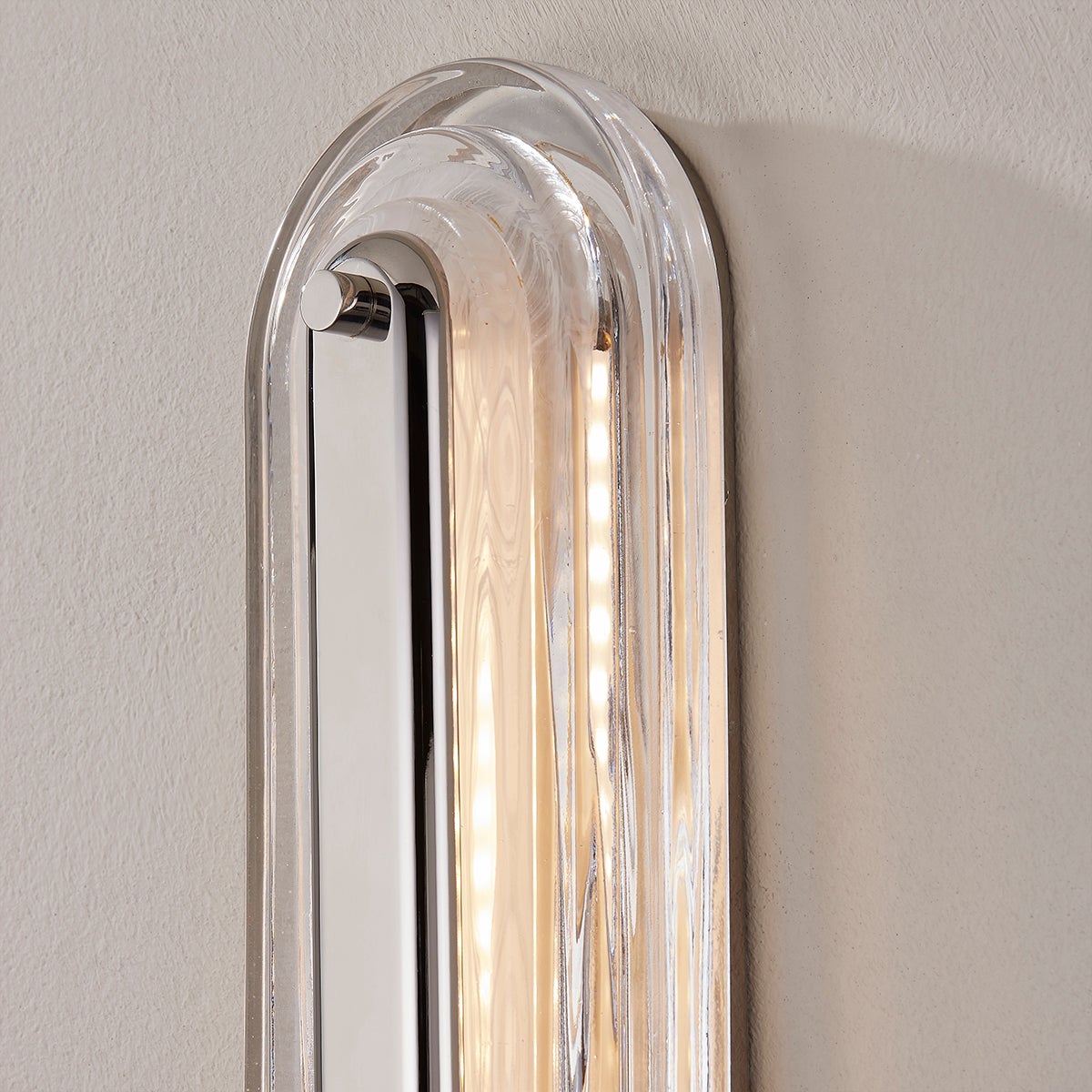 Close-up of the Litton Wall Sconce 5.75" x 28" in polished nickel showing the arm curve and shade silhouette.