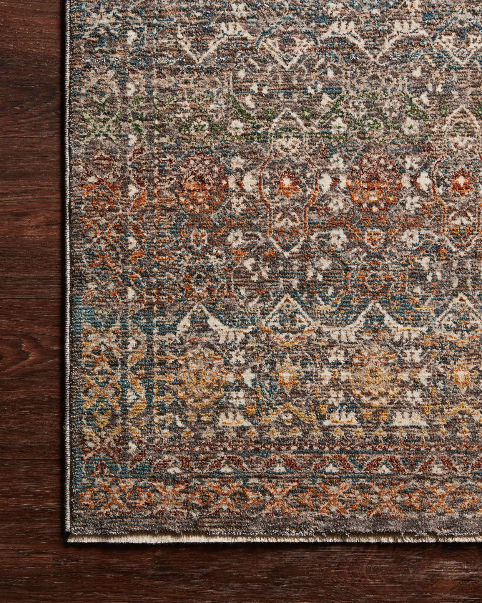 Side view of the Lourdes Stone / Multi rug.
