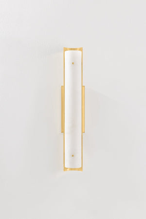 Lucio Wall Sconce 4.25" x 22.5" in aged brass shown from a second angle to highlight the arm curve and shade silhouette.