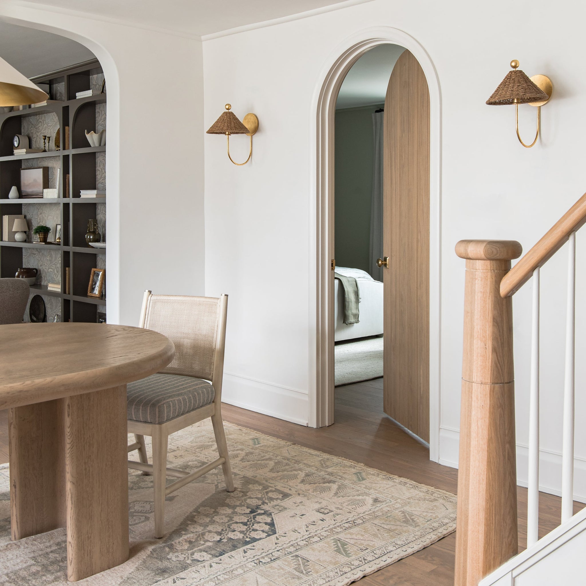 Layton Wall Sconce styled in a curated living room for warm, layered light at Laurie Yapp Home.