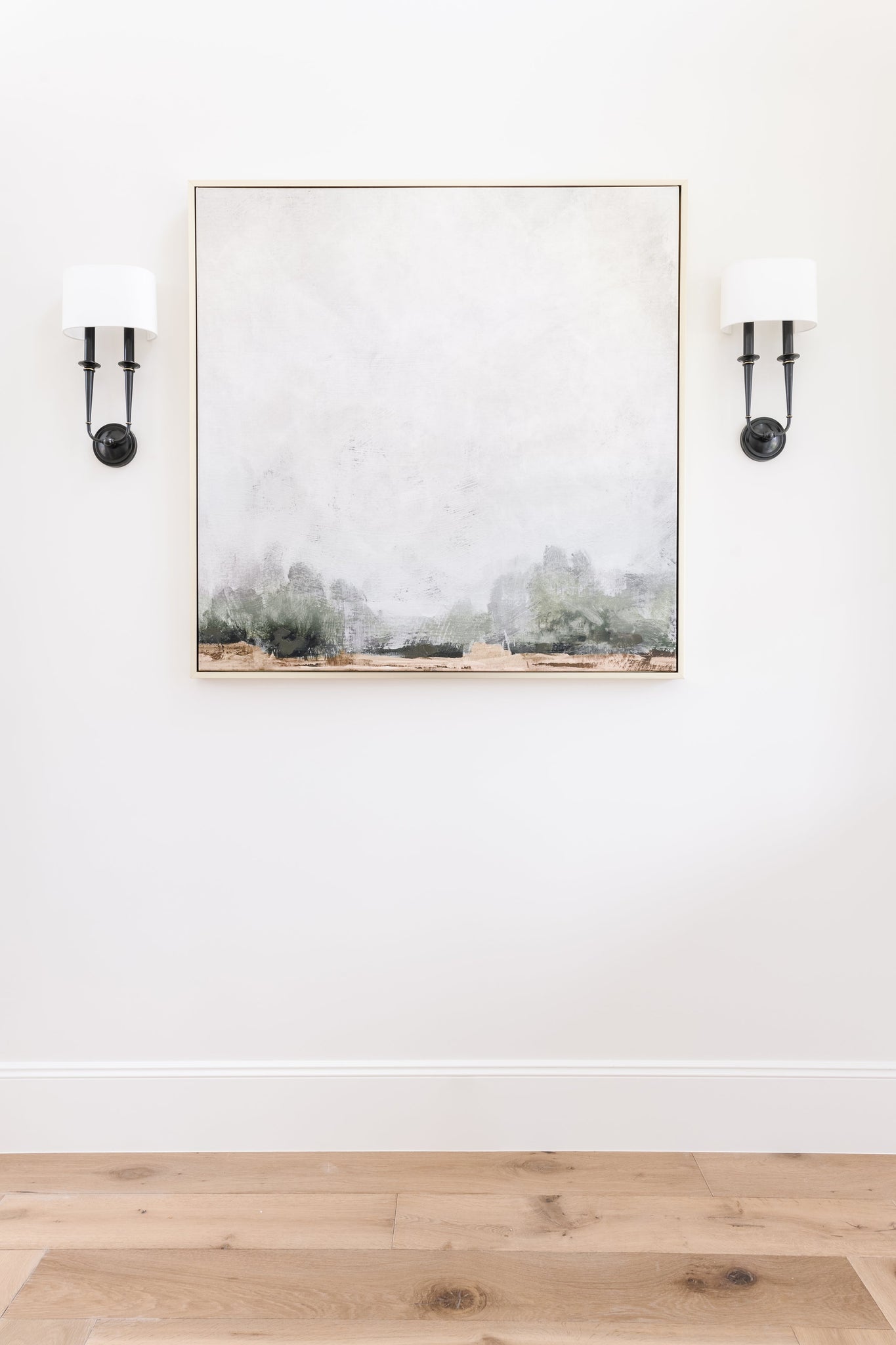 Lourdes Wall Sconce 9.5" in bronze styled in a curated living room for warm, layered light at Laurie Yapp Home.