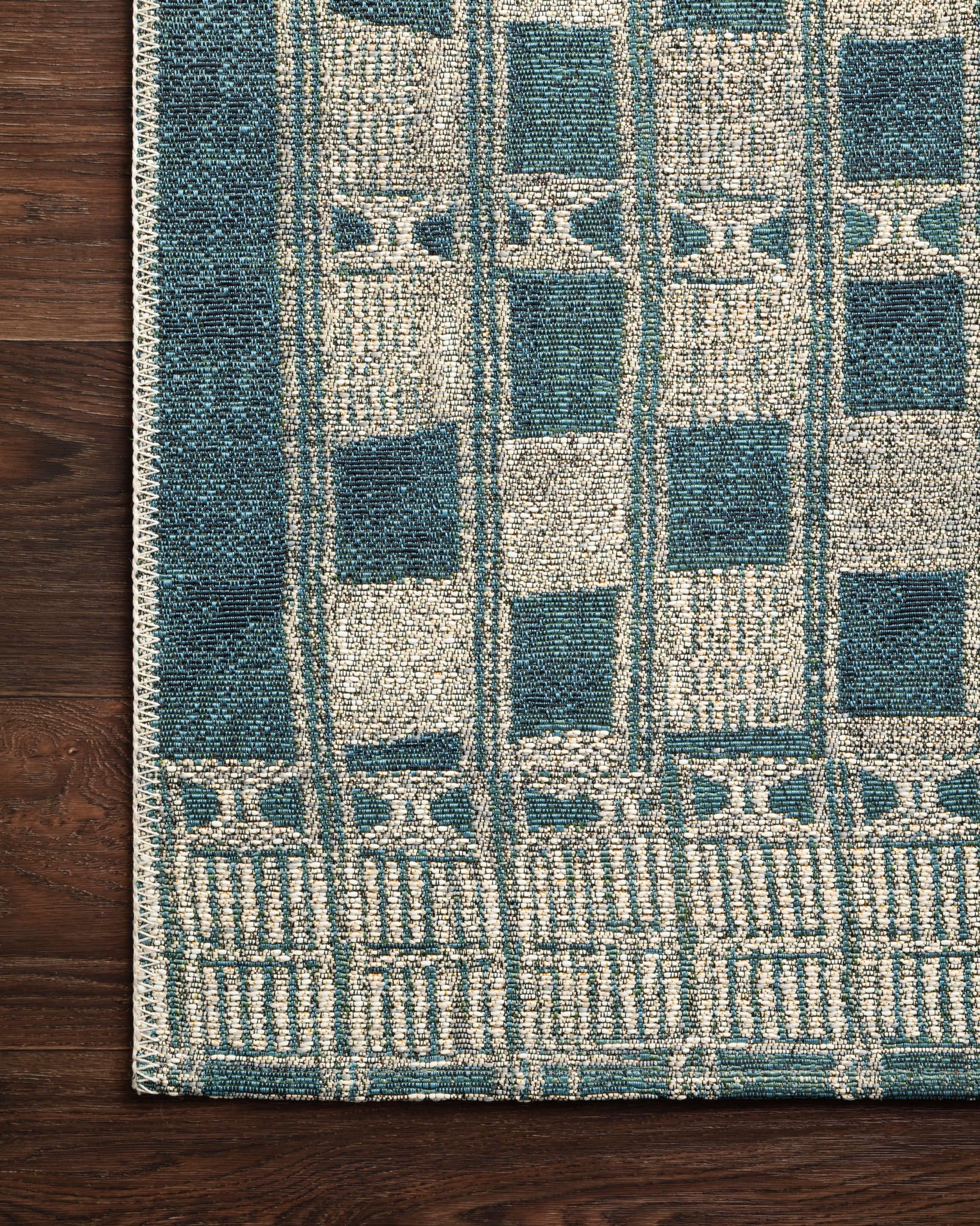 Close-up detail of the Mika Blue / Ivory showing its pile and weave.