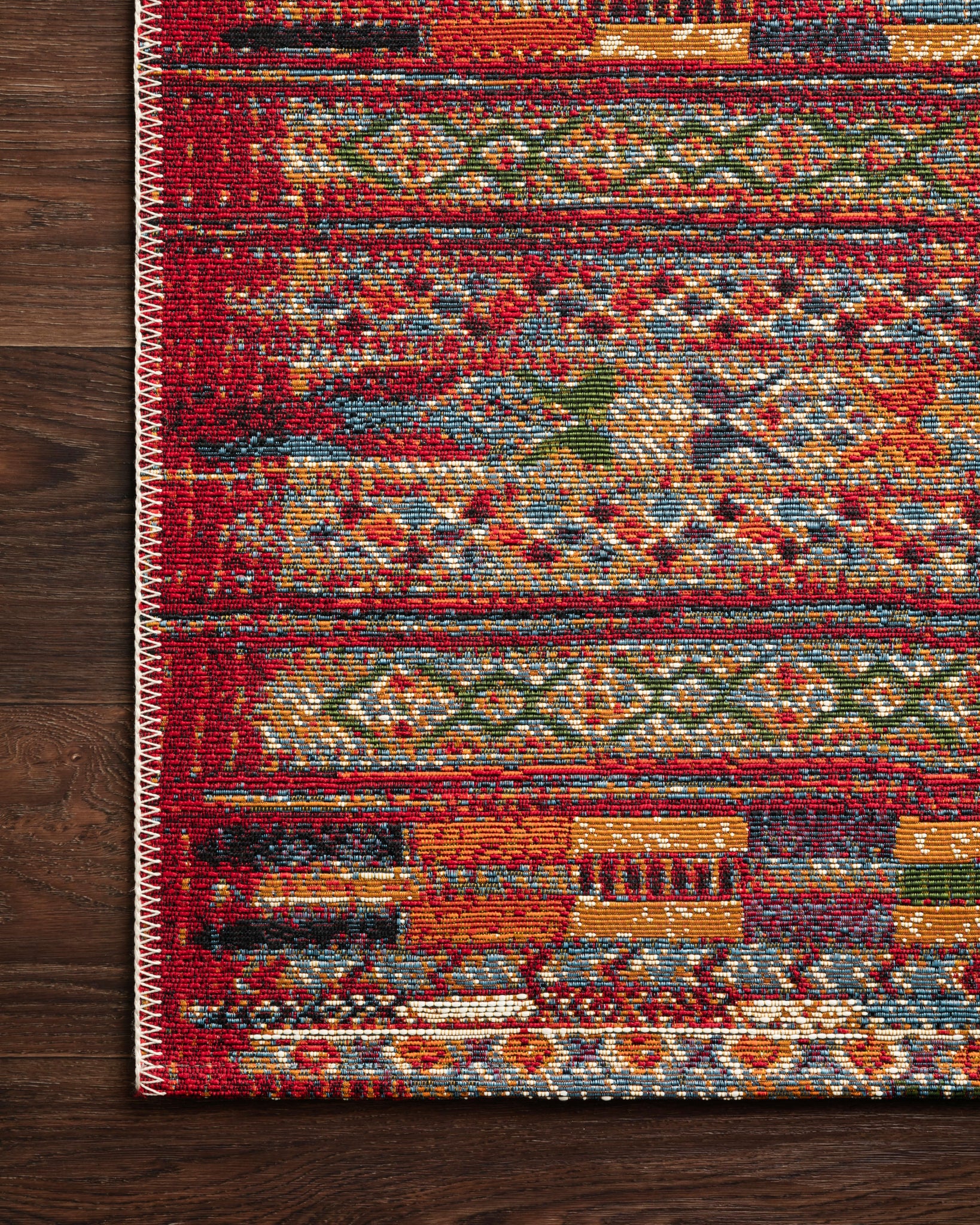 Close-up detail of the Mika Red / Multi showing its pile and weave.