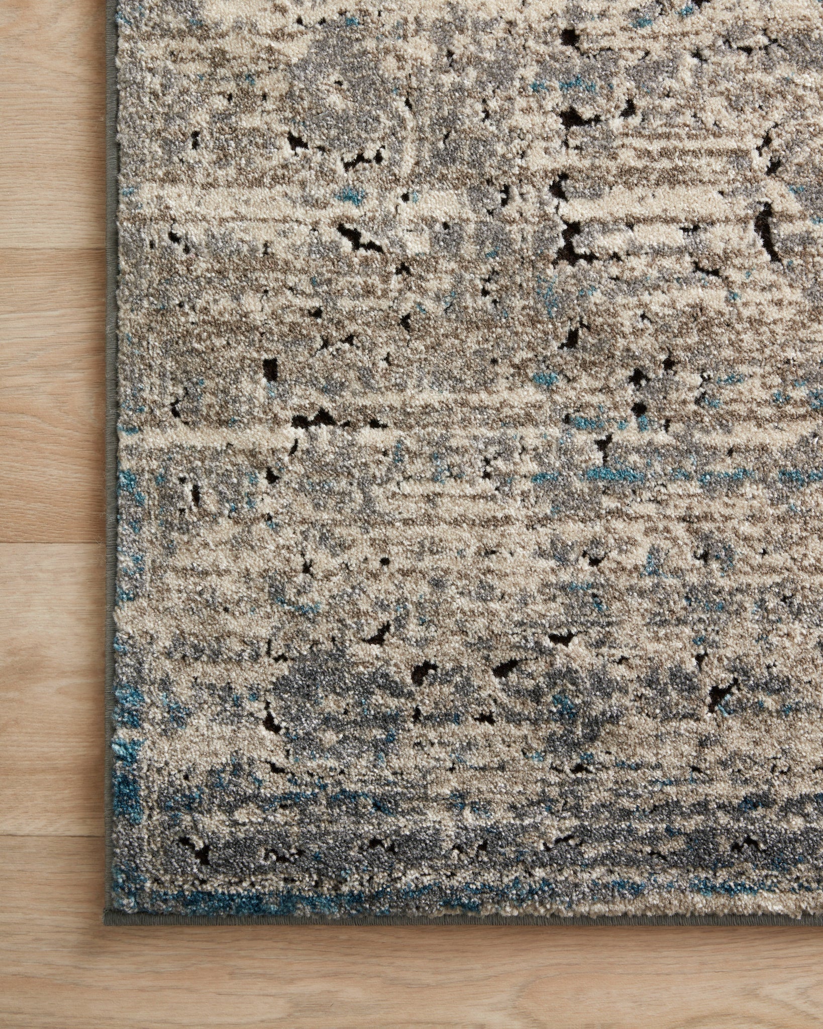 Close-up detail of the Millennium Grey / Blue showing its pile and weave.