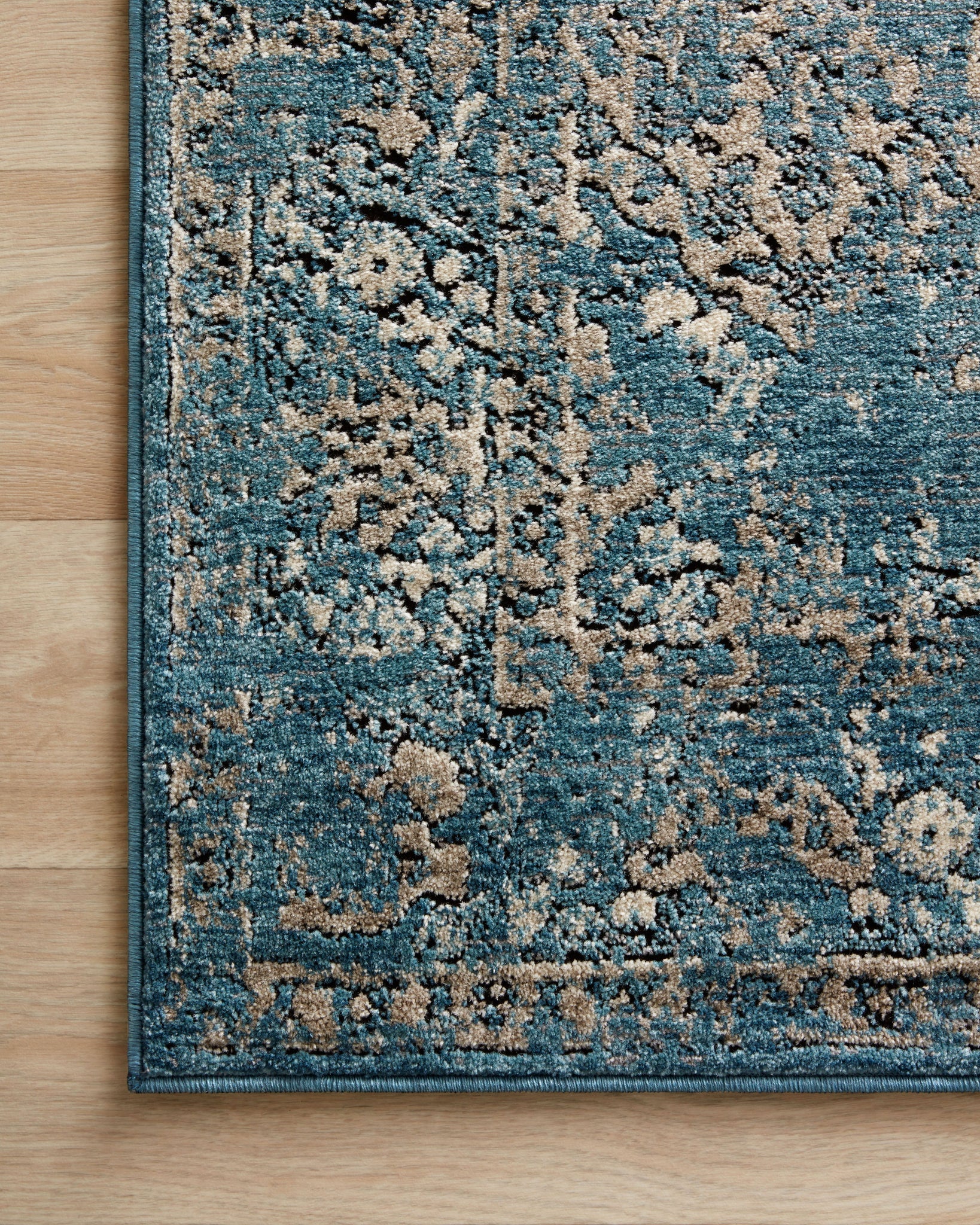 Close-up detail of the Millennium Blue / Taupe showing its pile and weave.