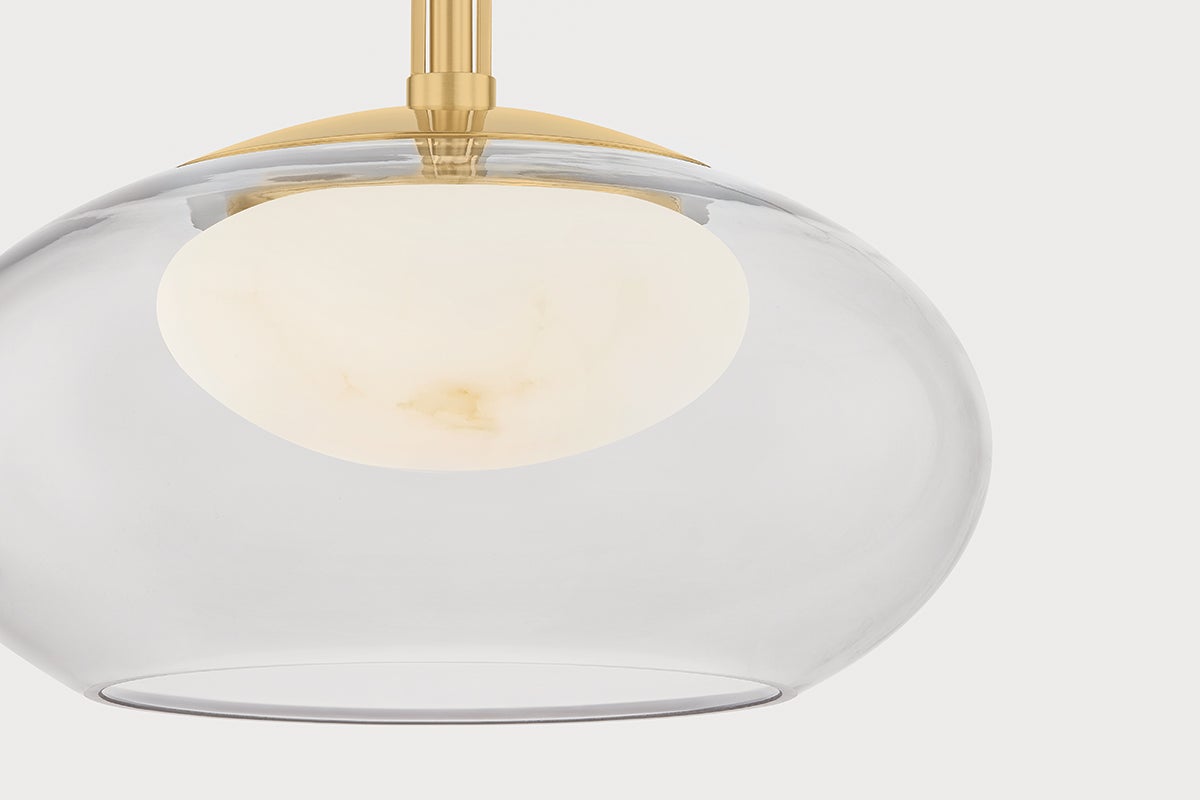 Moore Pendant 12" in aged brass shown from the front to reveal the shade shape and metal detail.