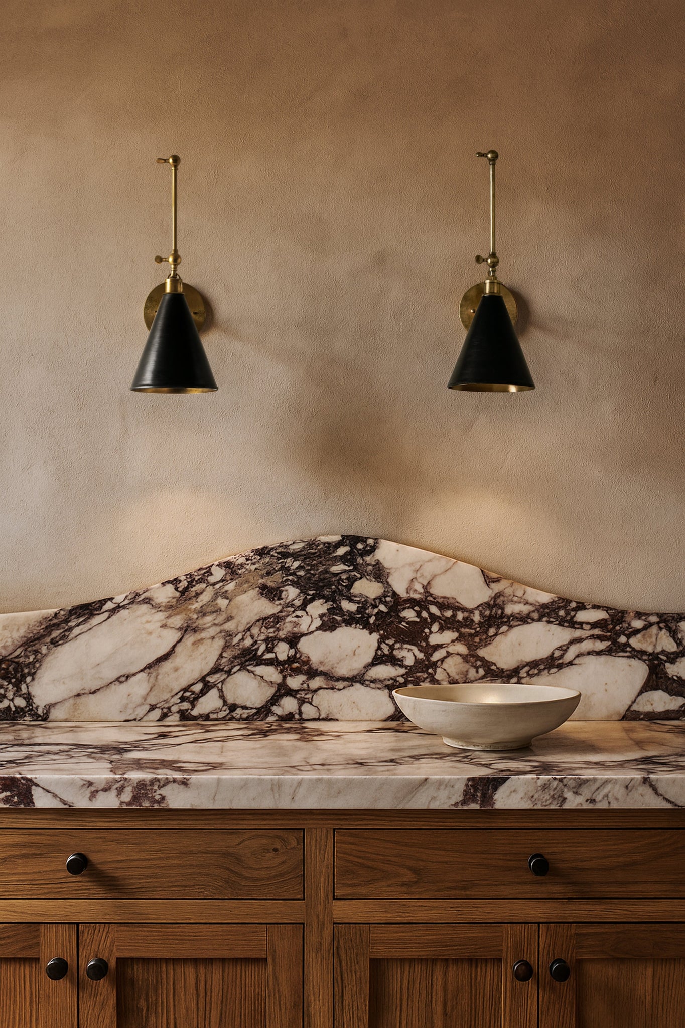 Osterley Wall Sconce 6.5" x 16" styled in a modern bathroom for warm, layered light at Laurie Yapp Home.