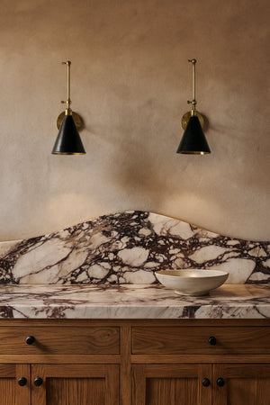 Osterley Wall Sconce 6.5" x 16" styled in a modern bathroom for warm, layered light at Laurie Yapp Home.