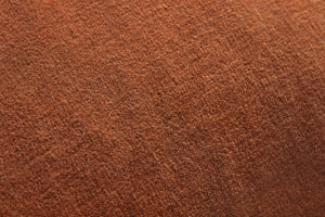 Liza Rust Pillow shown from another angle.