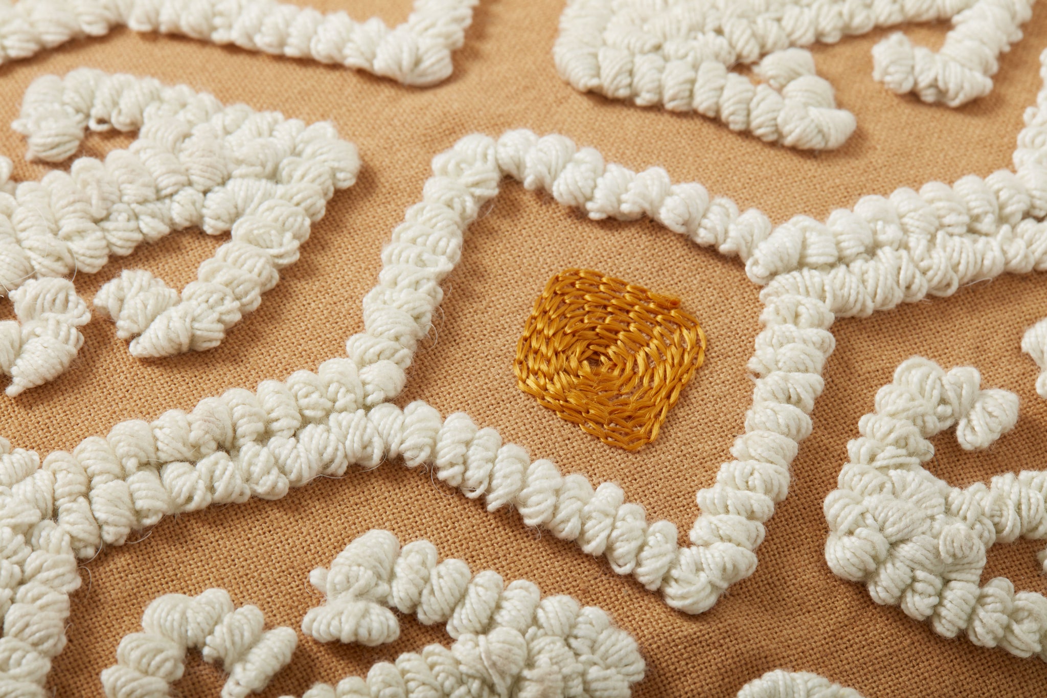 Ivory / Multi Pillow shown from a different angle to reveal its pattern.