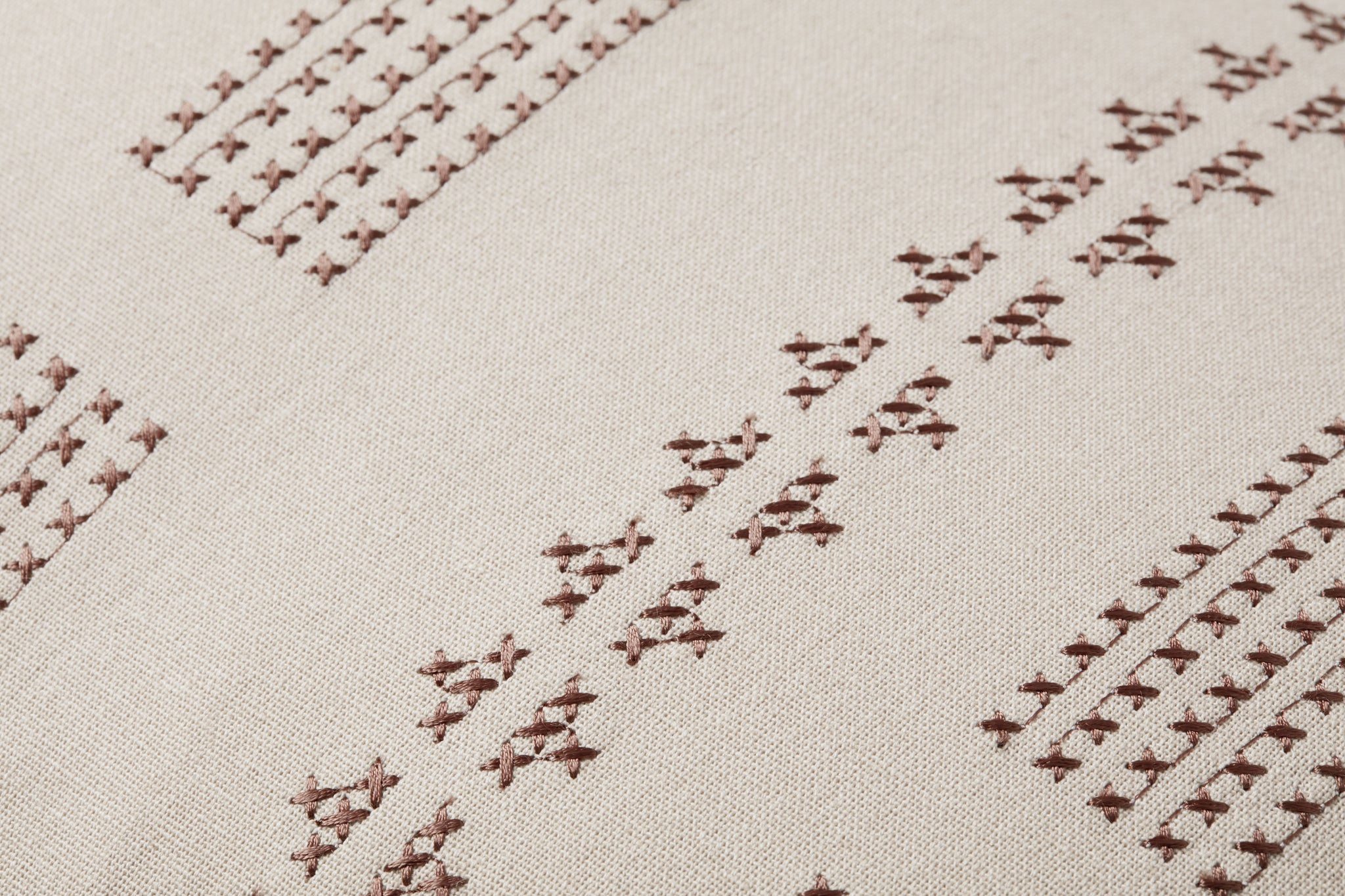 Thomas Natural Pillow shown from a different angle to reveal its pattern.