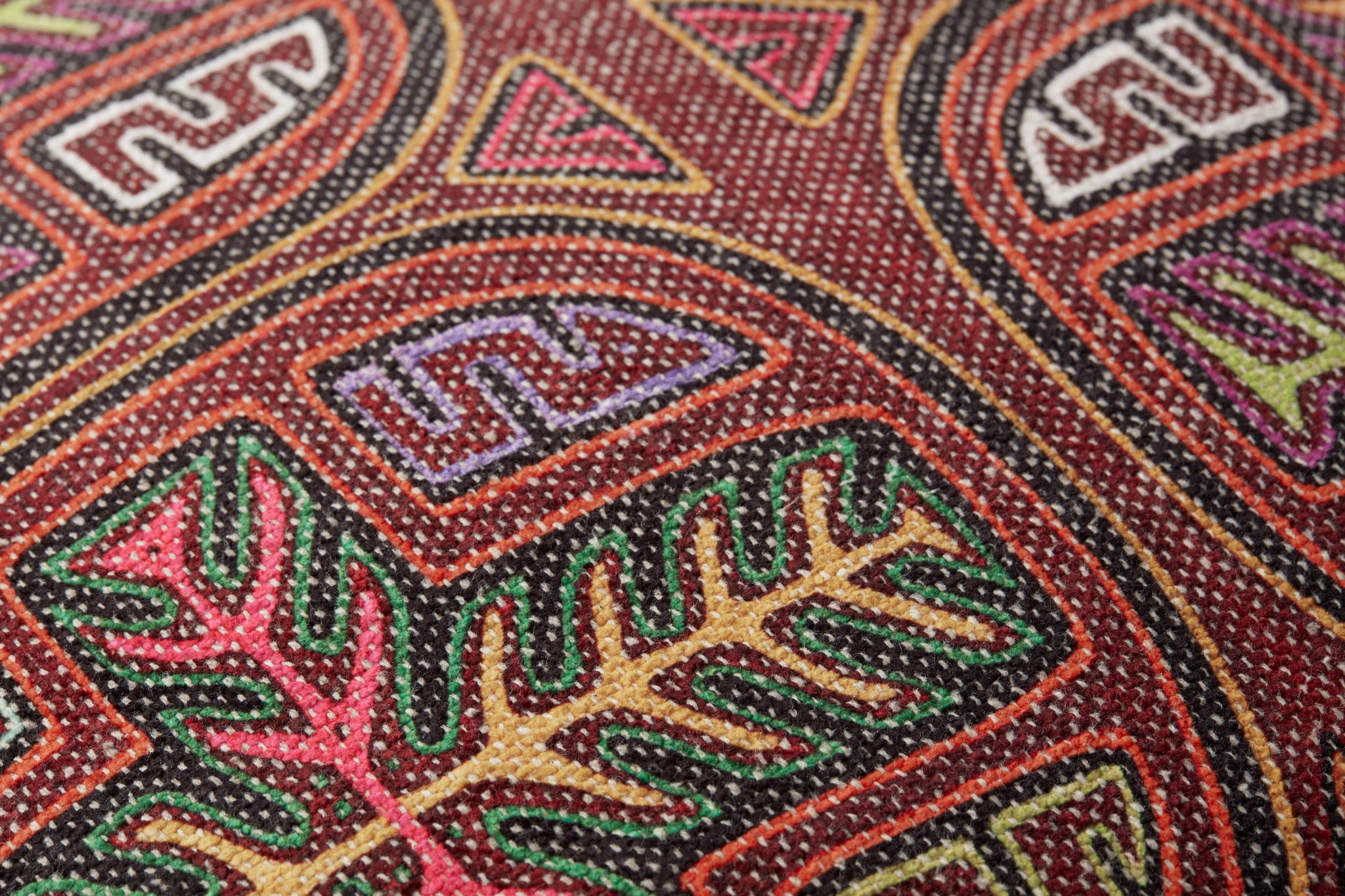Berry / Multi Pillow shown from a different angle to reveal its pattern.