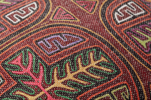 Berry / Multi Pillow shown from a different angle to reveal its pattern.