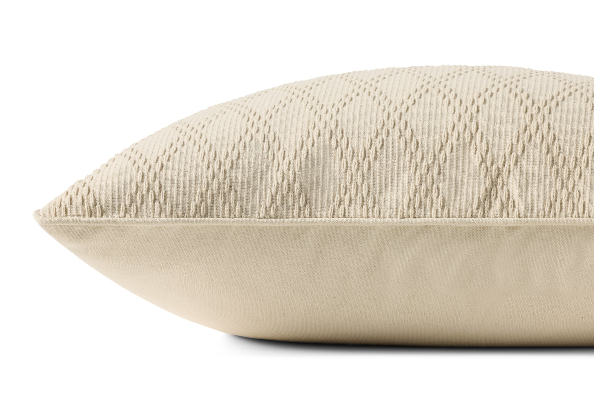Cary Ivory Pillow shown from a different angle to reveal its pattern.