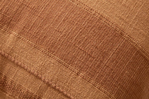 Mia Rust Pillow shown from a different angle to reveal its pattern.