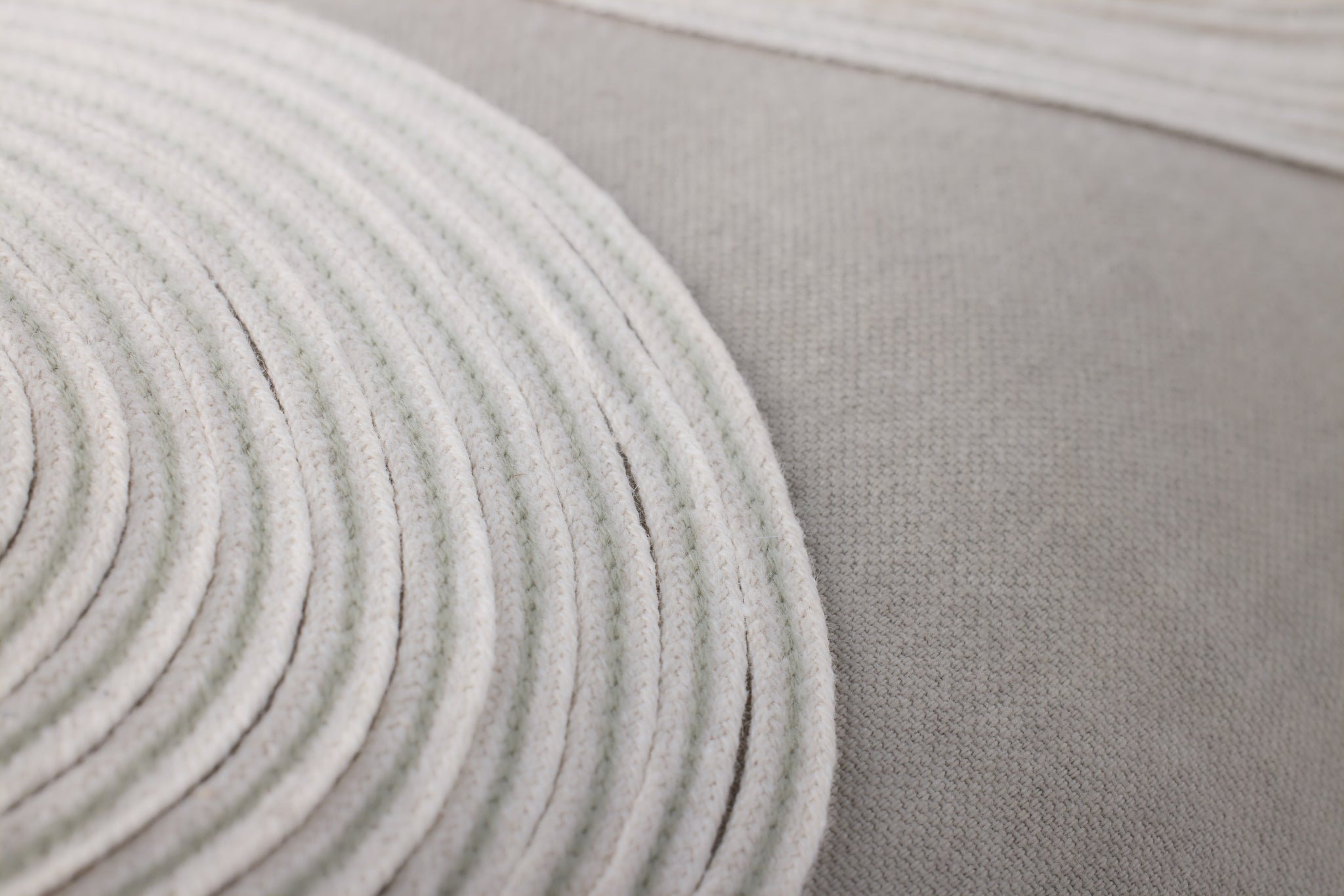 Taupe / Natural Pillow shown from a different angle to reveal its pattern.