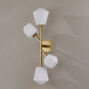 Close-up of the Tring Wall Sconce in aged brass showing the arm curve and shade silhouette.