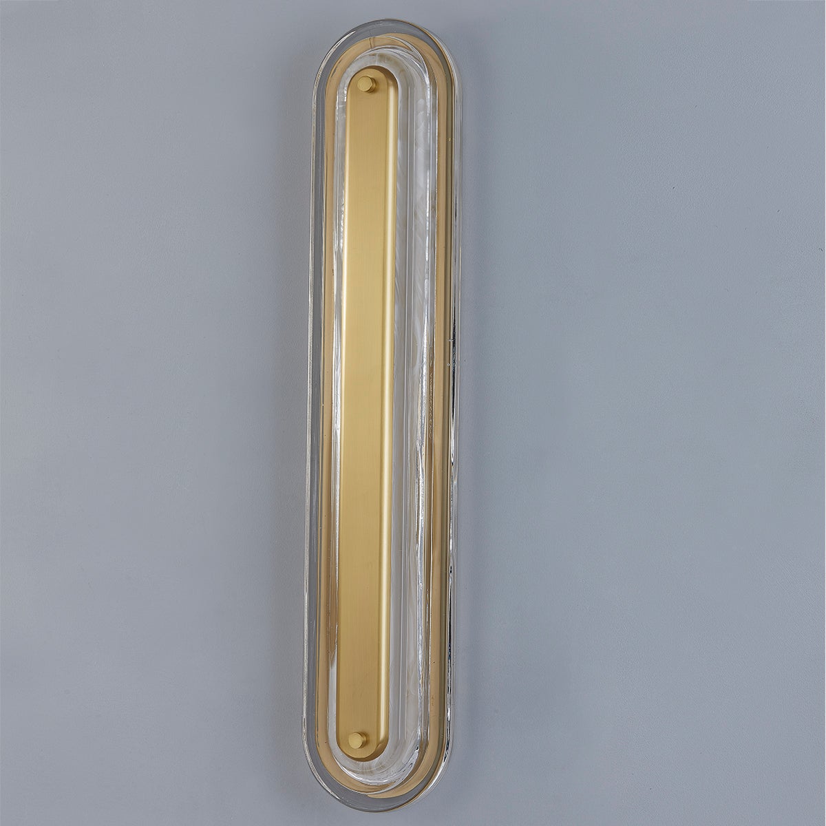 Close-up of the Litton Wall Sconce 5.75" x 28" in aged brass showing the arm curve and shade silhouette.