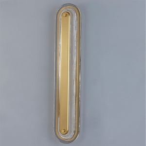 Close-up of the Litton Wall Sconce 5.75" x 28" in aged brass showing the arm curve and shade silhouette.