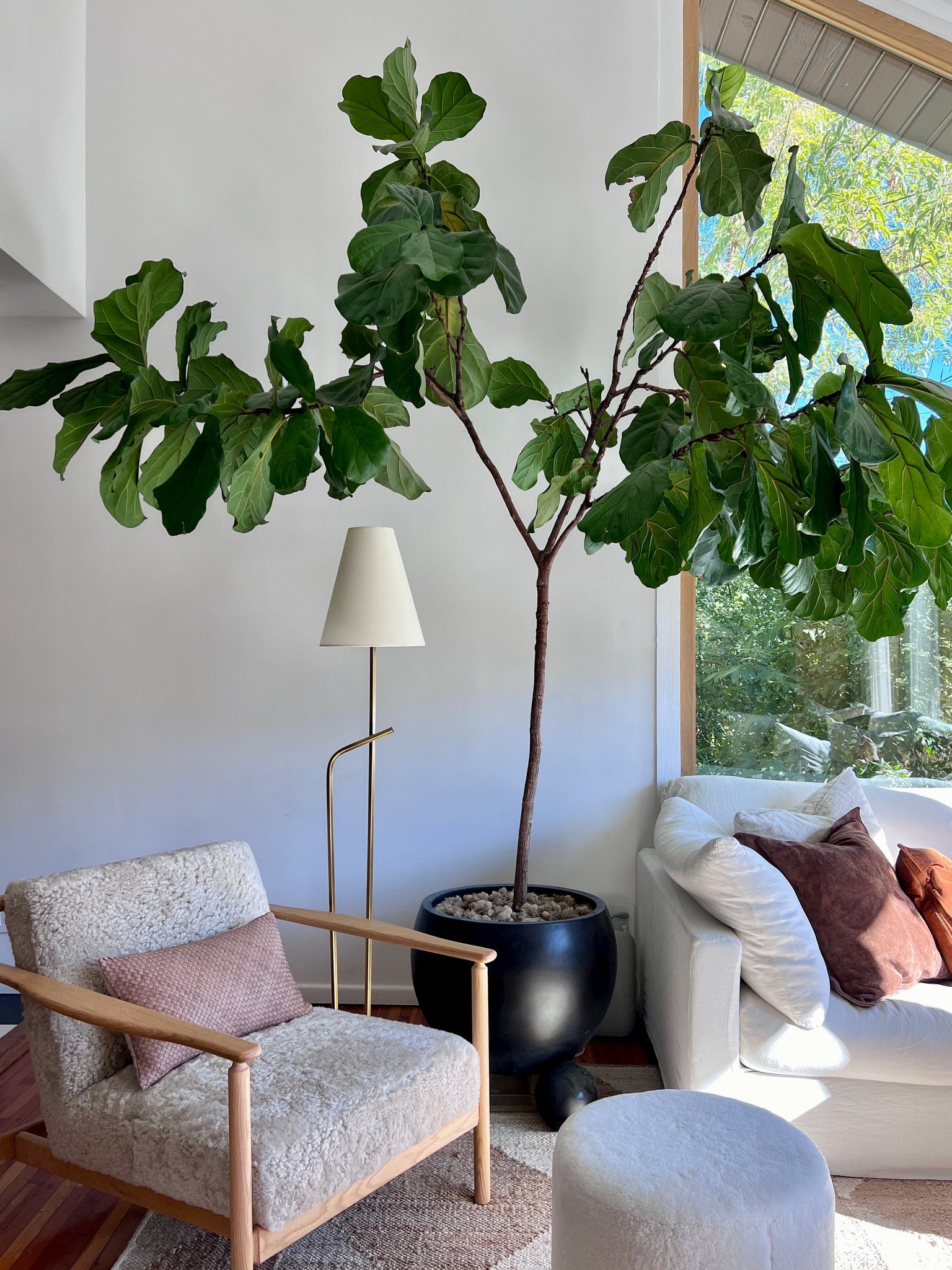 Pearce Floor Lamp styled in a reading nook for warm, layered light at Laurie Yapp Home.