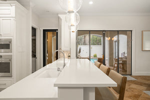 Pietra Pendant 12" styled in a welcoming entryway for warm, layered light at Laurie Yapp Home.