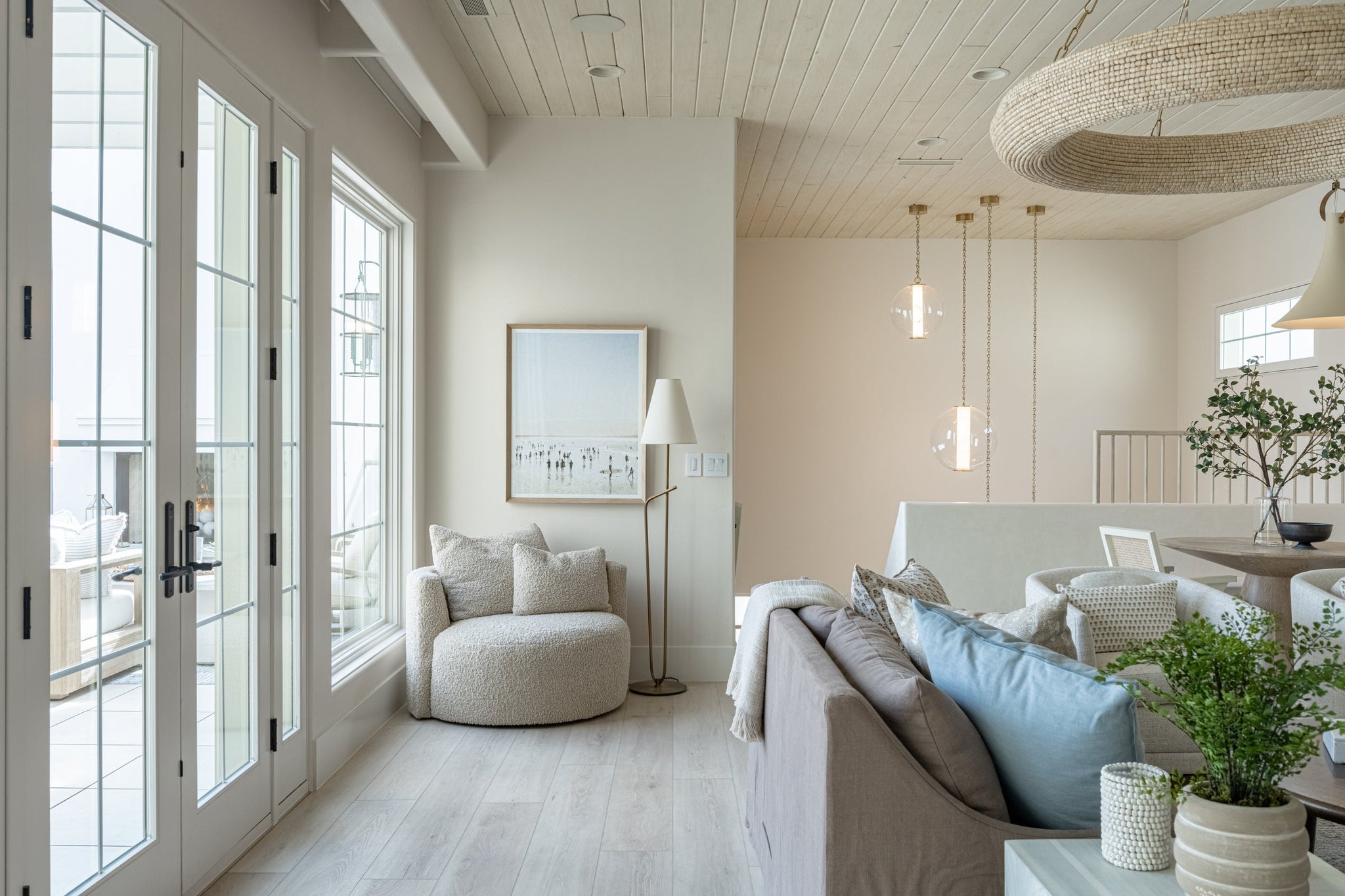 Lure Chandelier 50" styled in a formal living room for warm, layered light at Laurie Yapp Home.