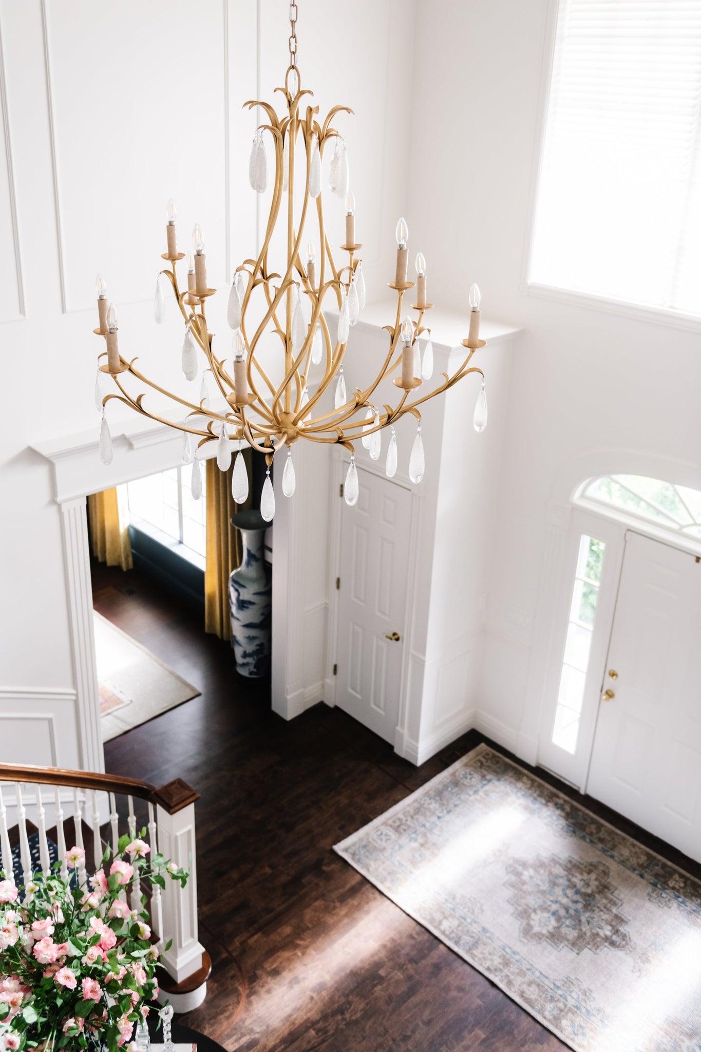Prosecco Chandelier 46.25" styled in a two-story entry for warm, layered light at Laurie Yapp Home.