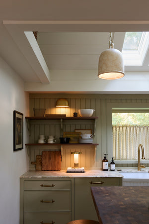 Sefton Rechargeable Table Lamp in aged brass styled in a curated interior for warm, layered light at Laurie Yapp Home.
