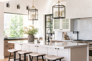 Ren Lantern 17.5" in bronze styled in a covered porch for warm, layered light at Laurie Yapp Home.
