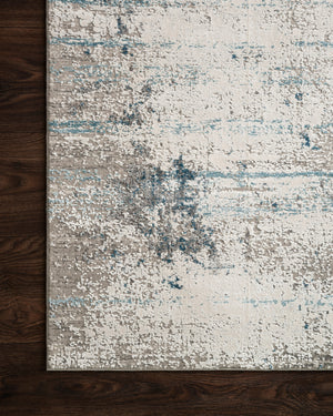 Side view of the Sienne Ivory / Ocean rug.