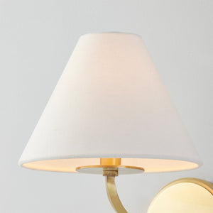 Stacey Wall Sconce in aged brass shown from a second angle to highlight the arm curve and shade silhouette.