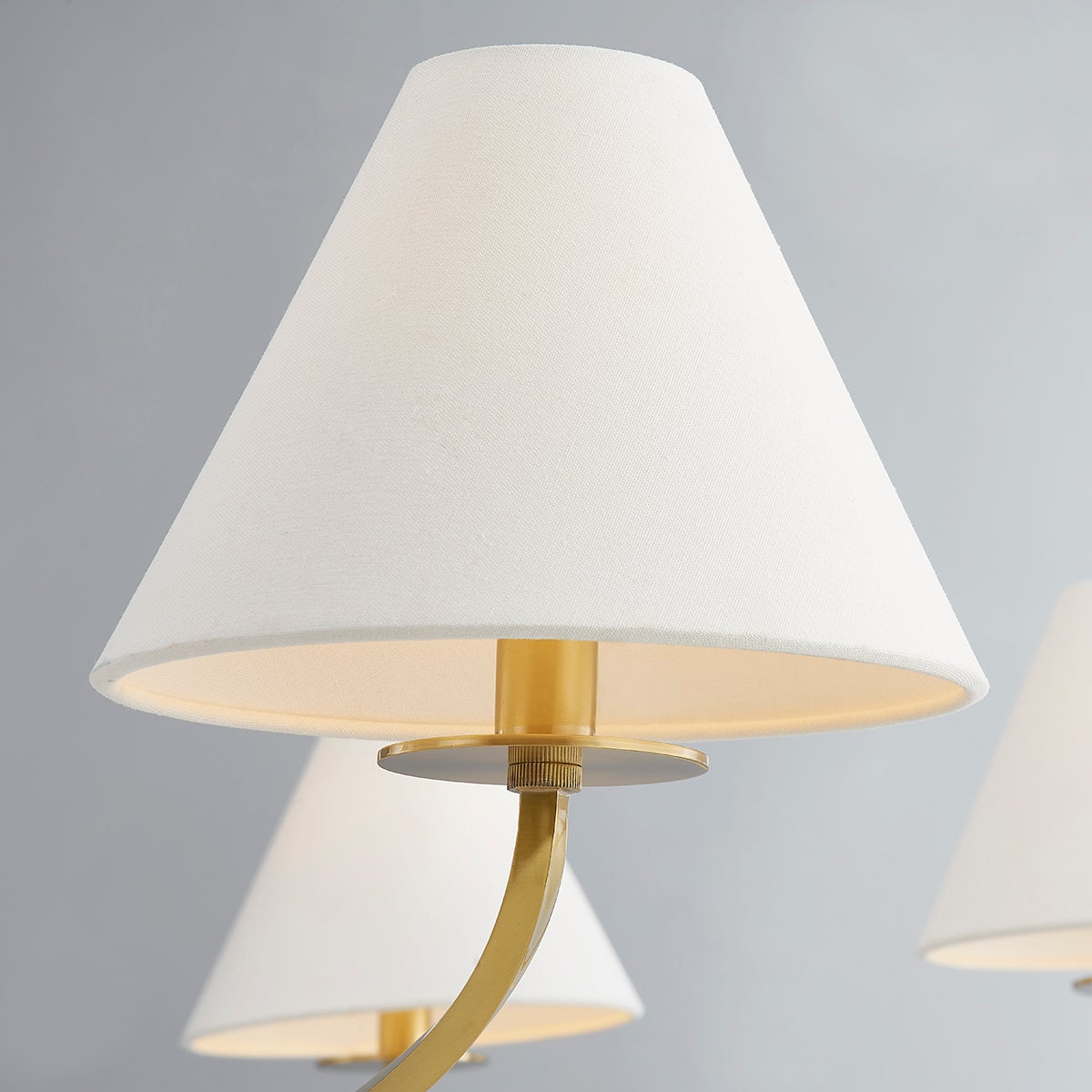 Stacey Chandelier 52.25" in aged brass shown from the front to reveal the frame, arms, and shade detail.