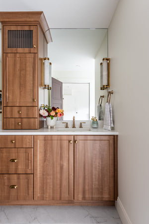 Sorrento Wall Sconce 3" x 17" styled in a warmly lit hallway for warm, layered light at Laurie Yapp Home.