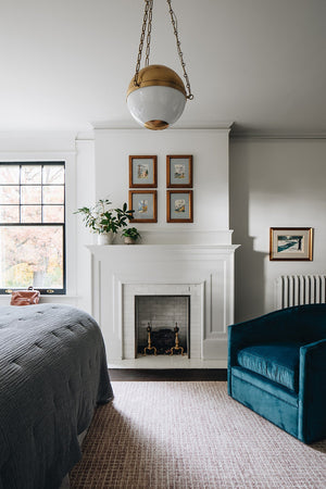 Sphere No.2 Pendant 20.5" in aged brass styled in a welcoming entryway for warm, layered light at Laurie Yapp Home.