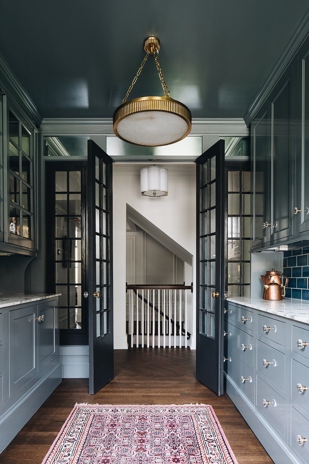 Lynden Chandelier 22" in aged brass styled in a formal living room for warm, layered light at Laurie Yapp Home.