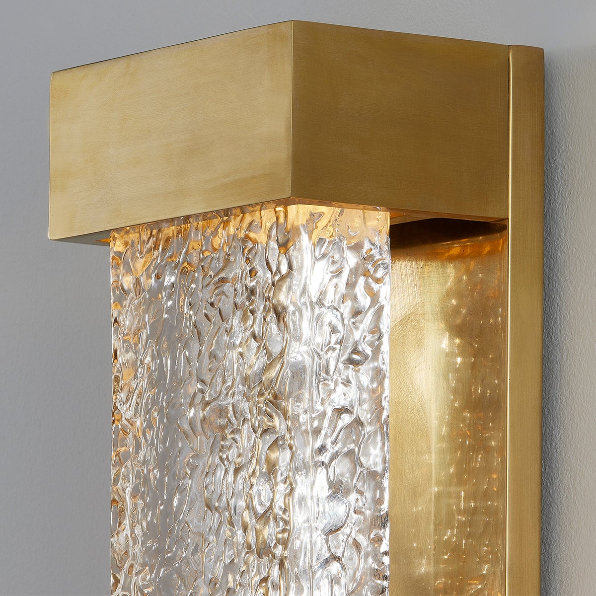 Wharton Wall Sconce 5" x 15" in aged brass shown from a second angle to highlight the arm curve and shade silhouette.