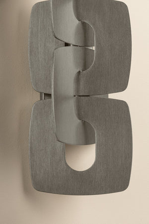 Close-up of the Trentino Wall Sconce showing the arm curve and shade silhouette.
