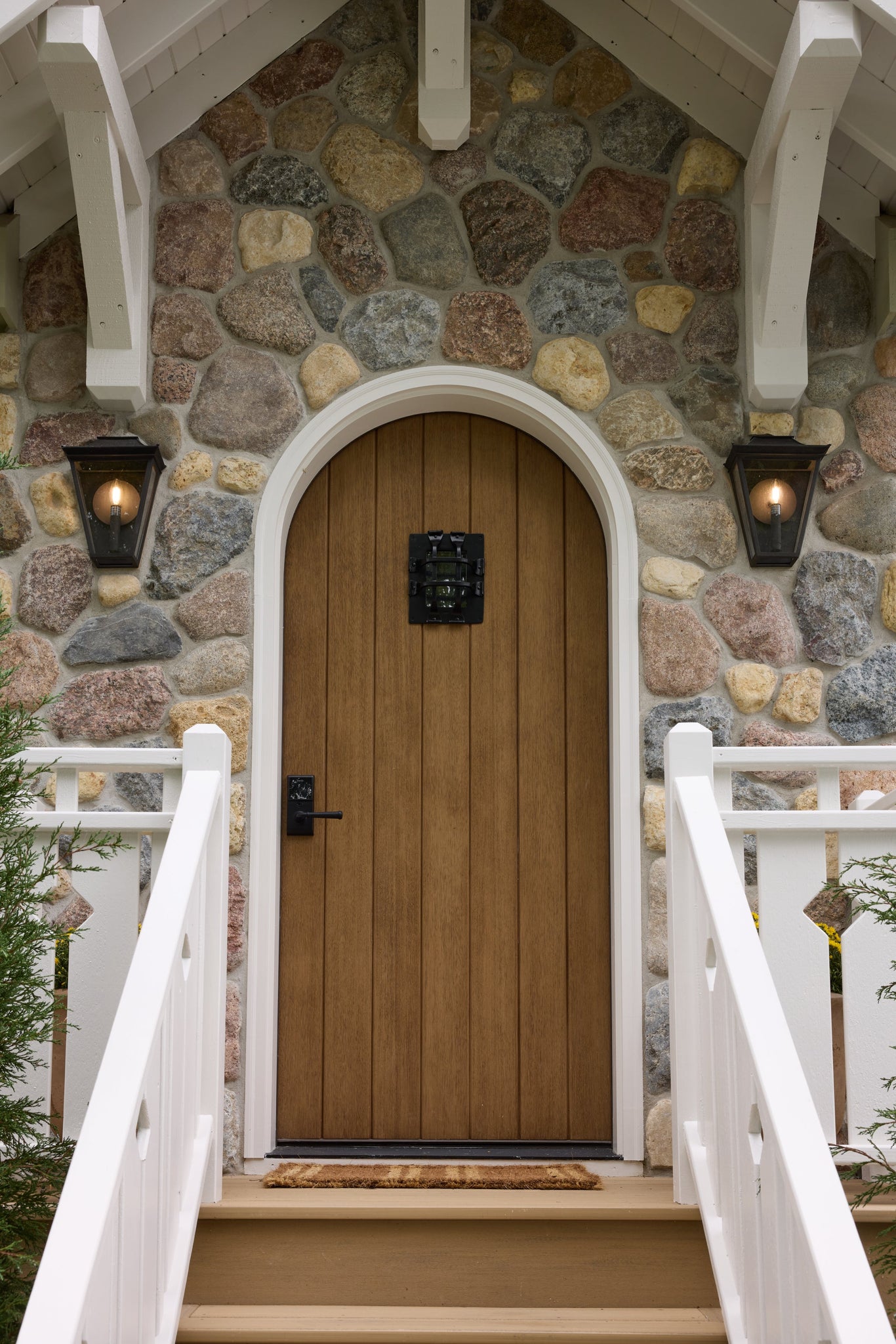 Tehama Exterior Wall Sconce 10" styled in a warmly lit hallway for warm, layered light at Laurie Yapp Home.