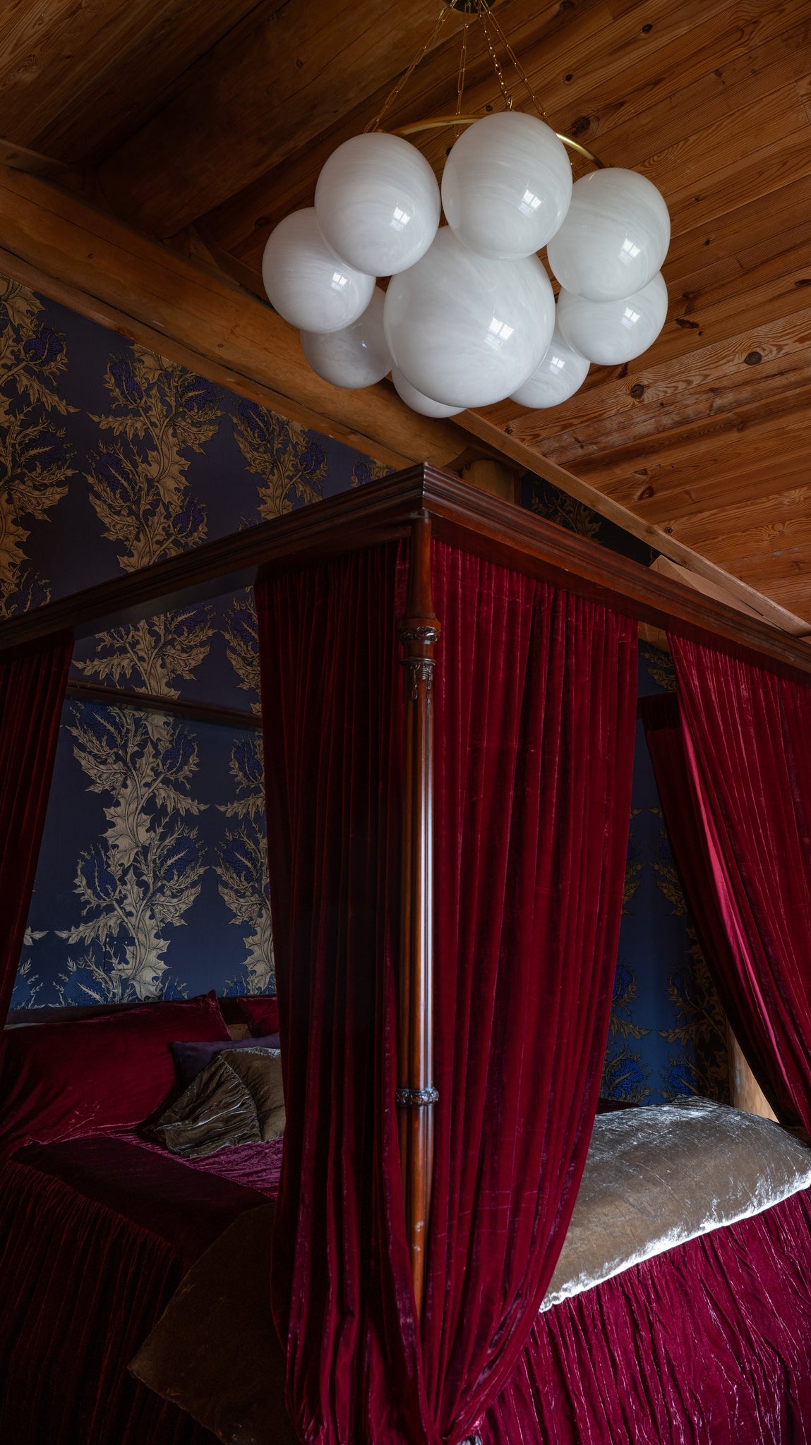 Thornwood Chandelier 43.25" in aged brass styled in a formal living room for warm, layered light at Laurie Yapp Home.
