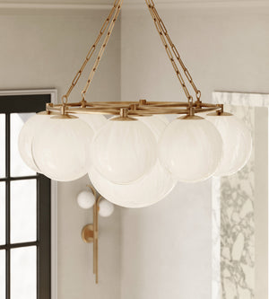 Close-up of the Thornwood Chandelier 43.25" in aged brass showing the frame, arms, and shade detail.