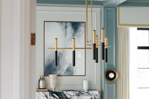 Close-up of the Tobia Wall Sconce showing the arm curve and shade silhouette.