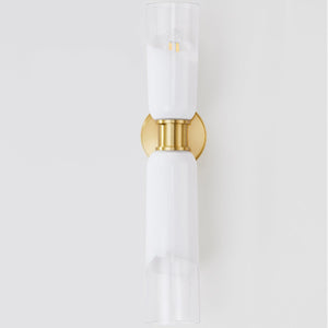 Close-up of the Wasson Wall Sconce in aged brass showing the arm curve and shade silhouette.