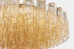 Watertown Chandelier 33" in aged brass shown from the front to reveal the frame, arms, and shade detail.