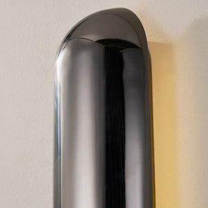 Close-up of the Wheeler Wall Sconce showing the arm curve and shade silhouette.